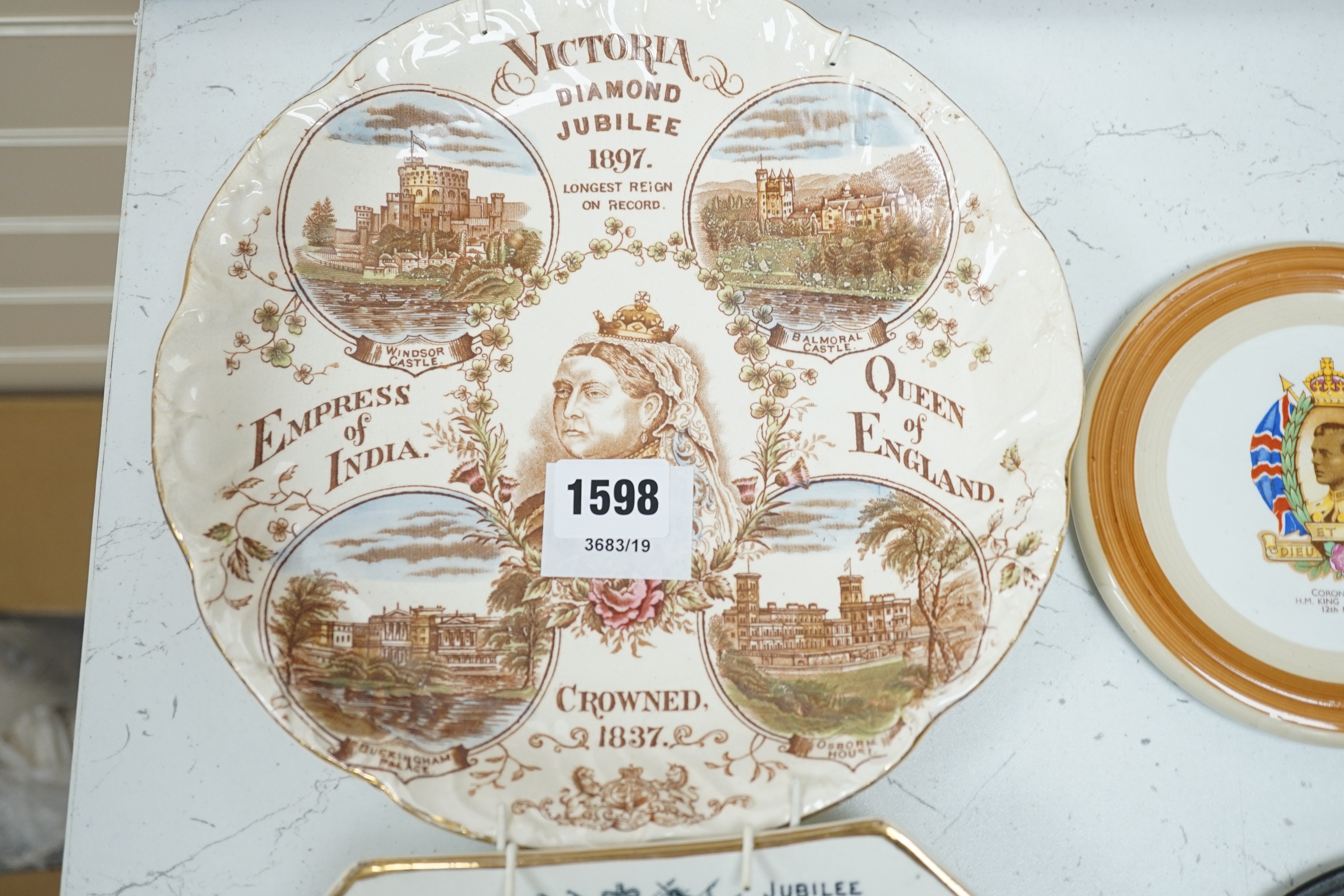 A Queen Victoria Balance of Payments plate, a memoriam plaque an 1897 Diamond Jubilee plate and a Diamond Jubilee procession chromolithograph